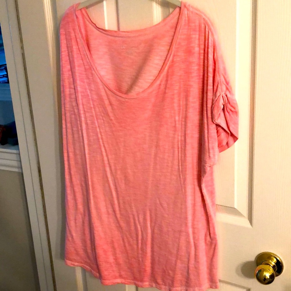 Short sleeve shirt with cuffed sleeves.